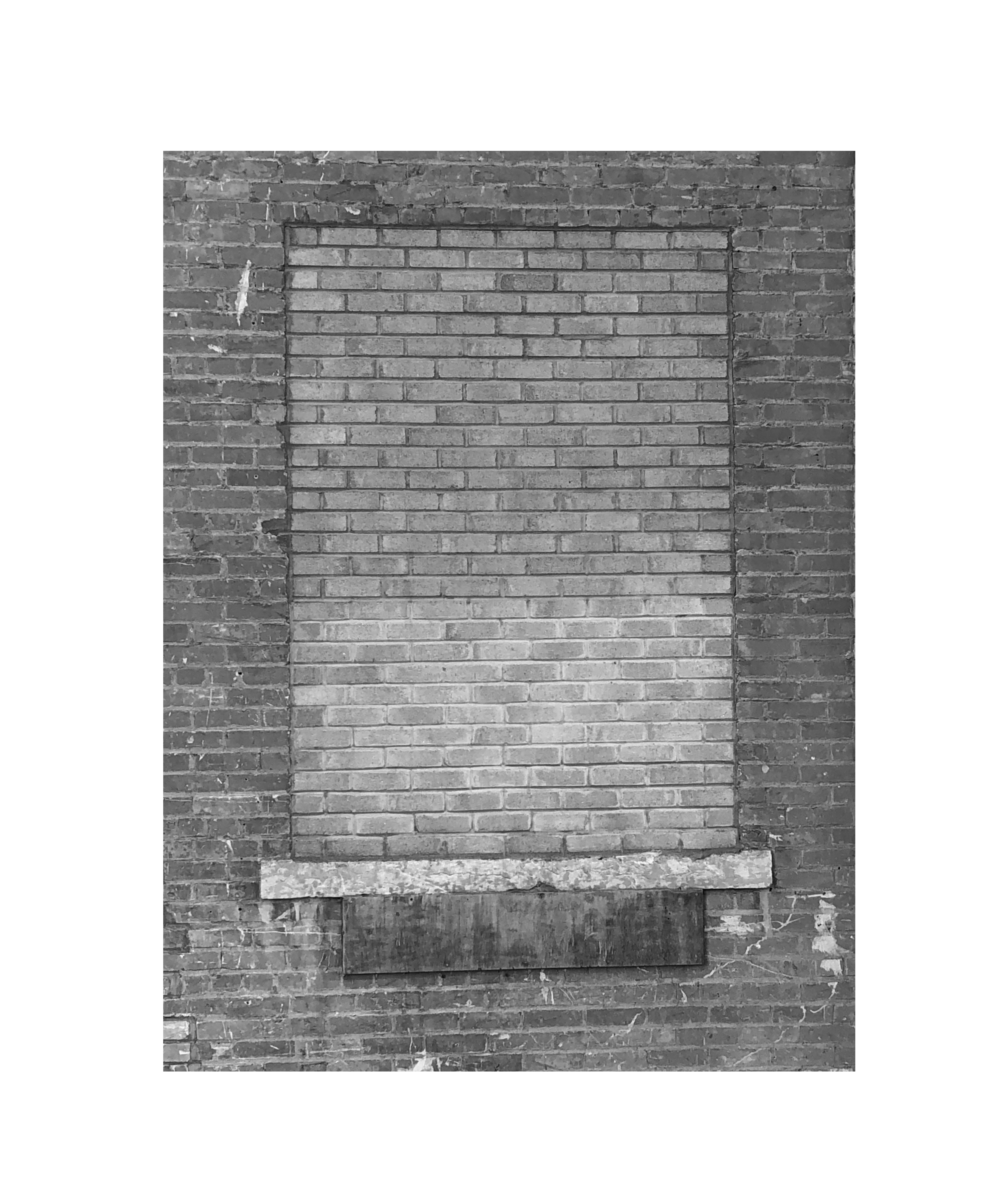 photograph of a bricked up window